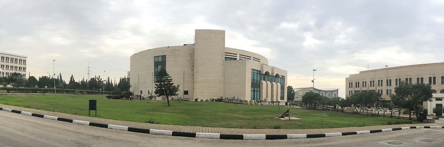 Panoramic view of City University's campus buildings and lawns in Tripoli, North Lebanon